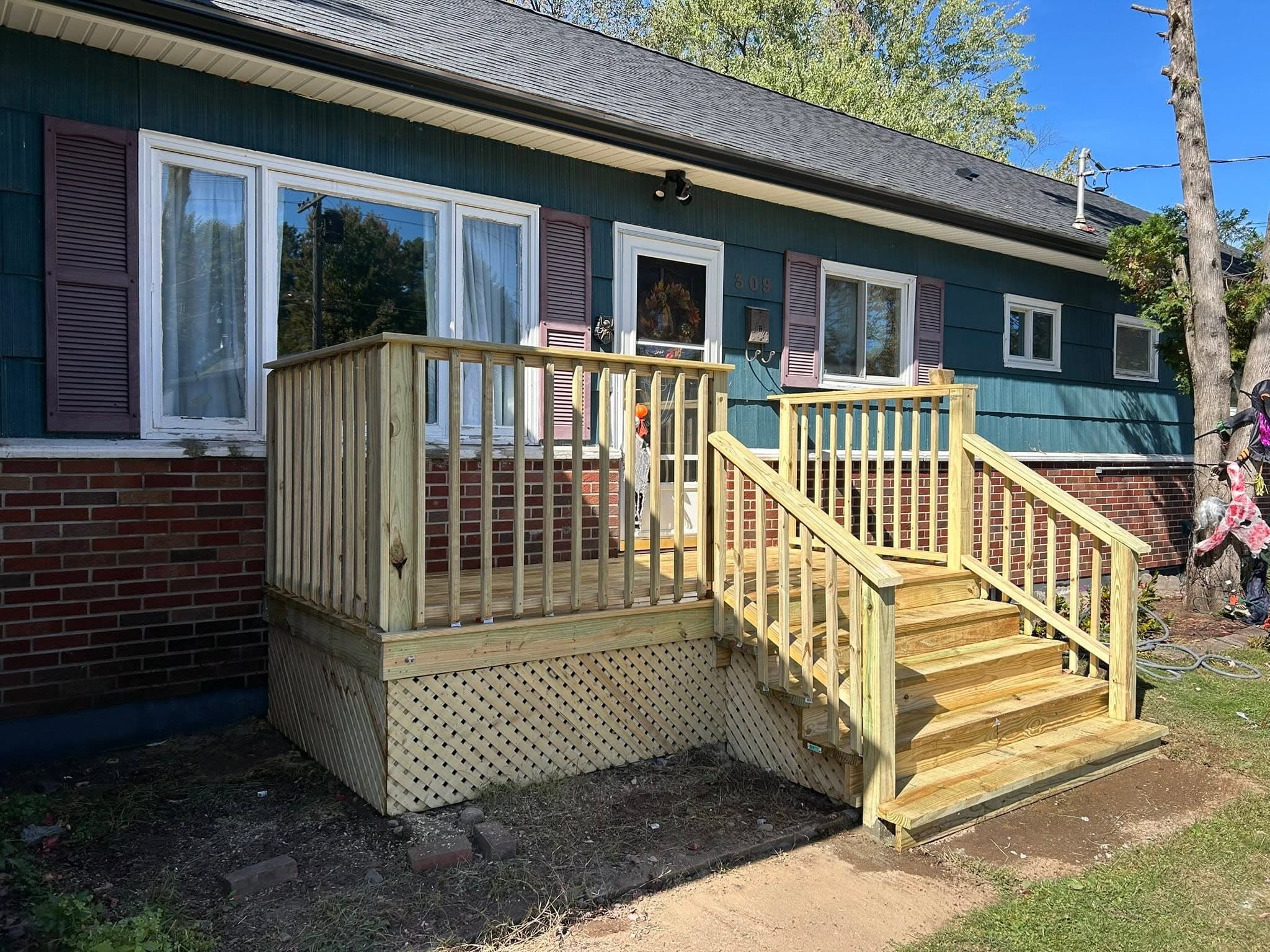 New pressure-treated deck, stairs, and railings built by Martelli & Son