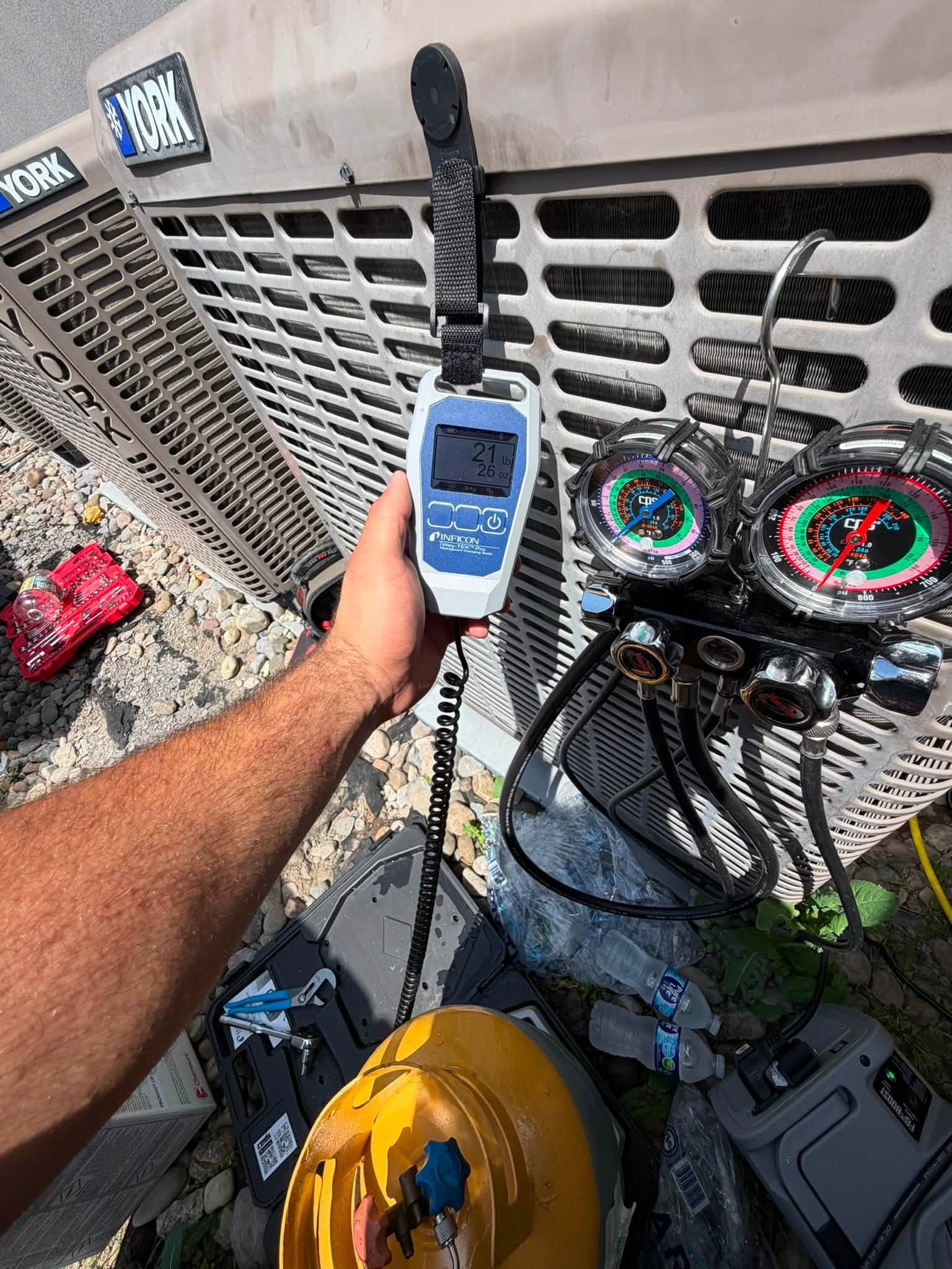 Martelli & Son checking refrigerant charge on a York AC system in Central New York